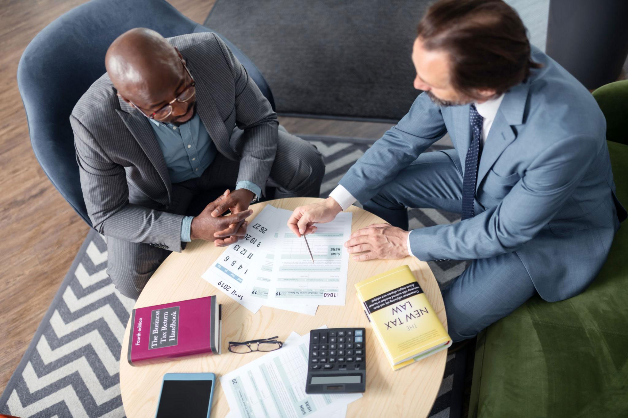 Divorce lawyer and client reviewing documents